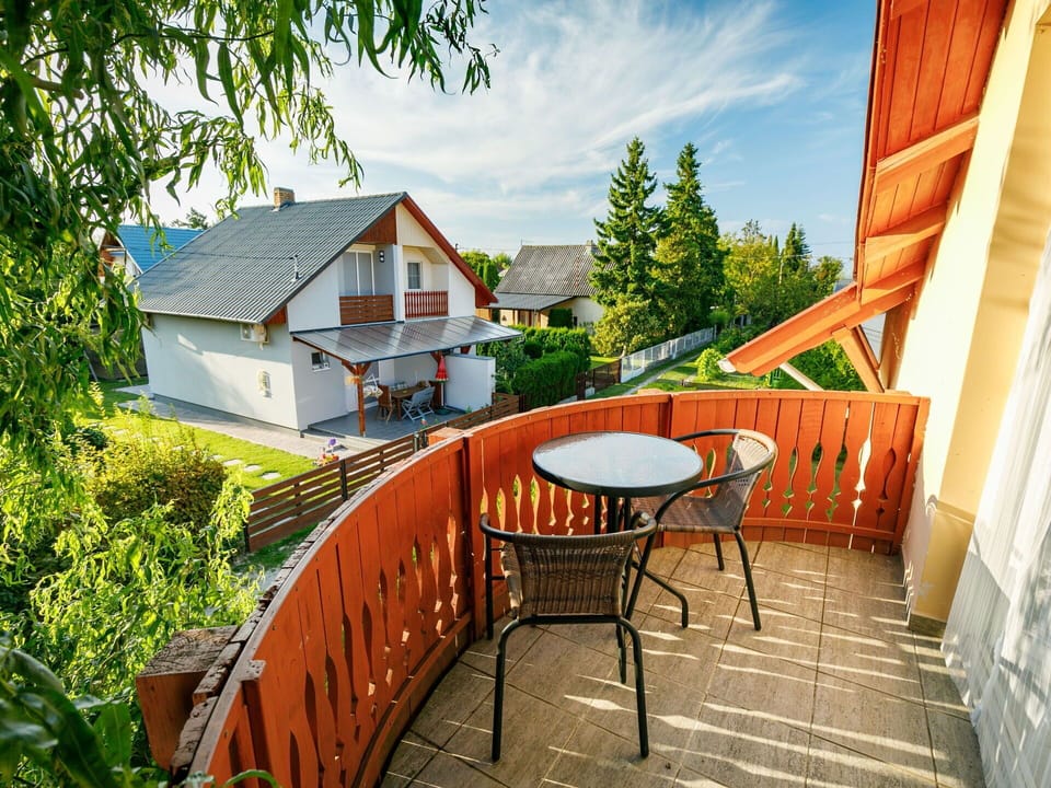 Sky, Building, Table, Furniture, Property, Cloud, Chair, Plant, Tree, Wood