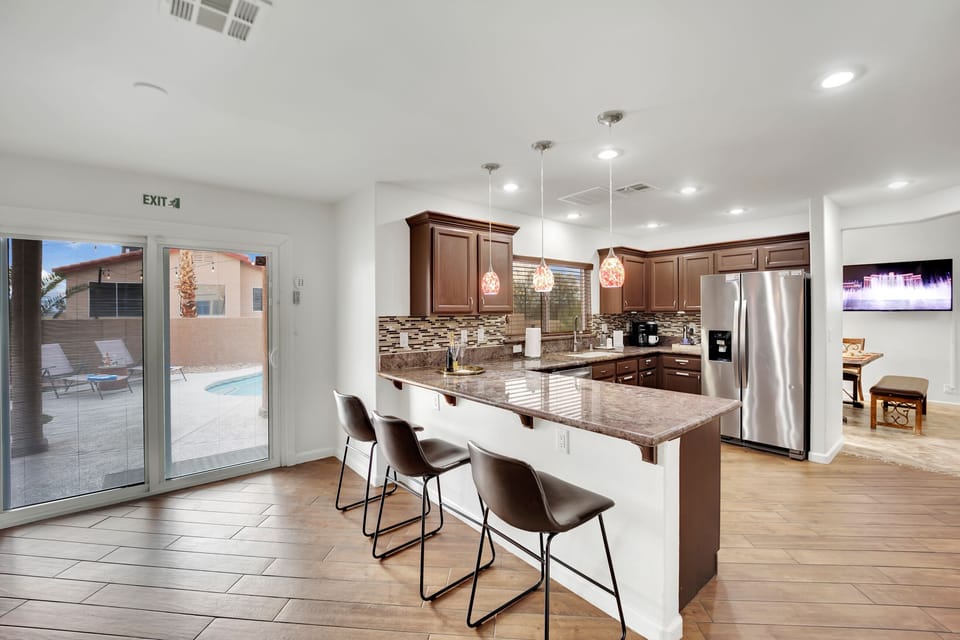 The journey continues into a spacious, open kitchen, perfect for culinary aficionados to unleash their creativity.