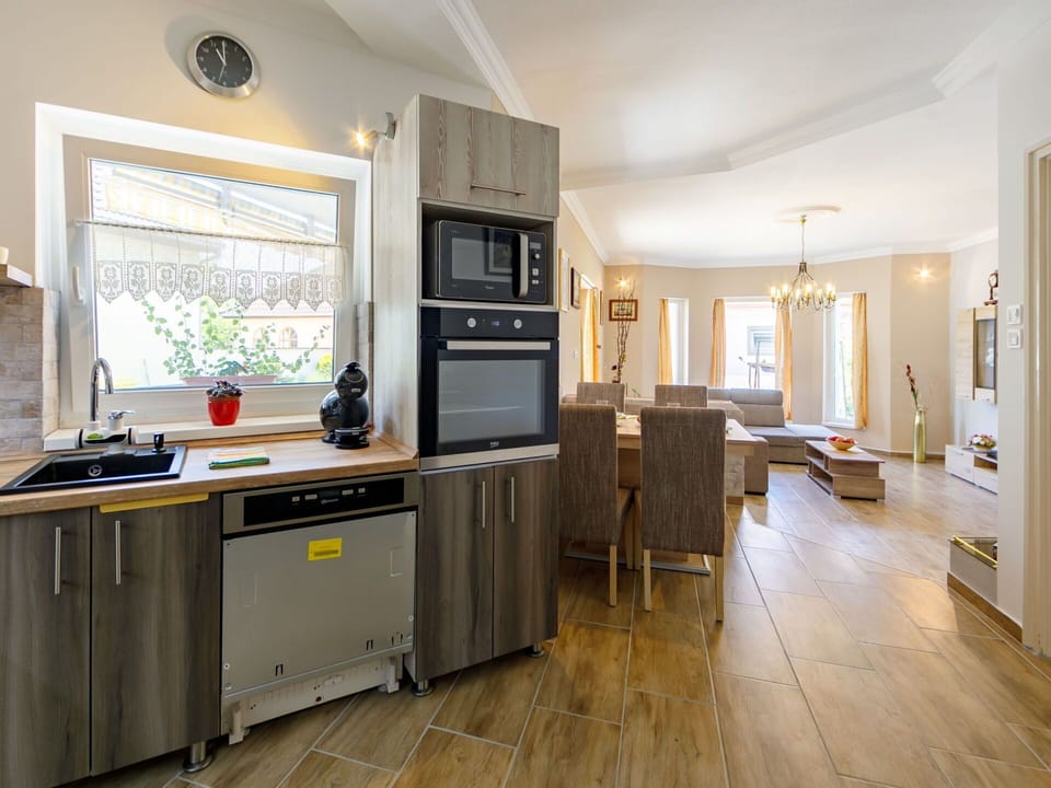 Kitchen Sink, Cabinetry, Countertop, Sink, Furniture, Building, Wood, Kitchen Appliance, Lighting, Kitchen