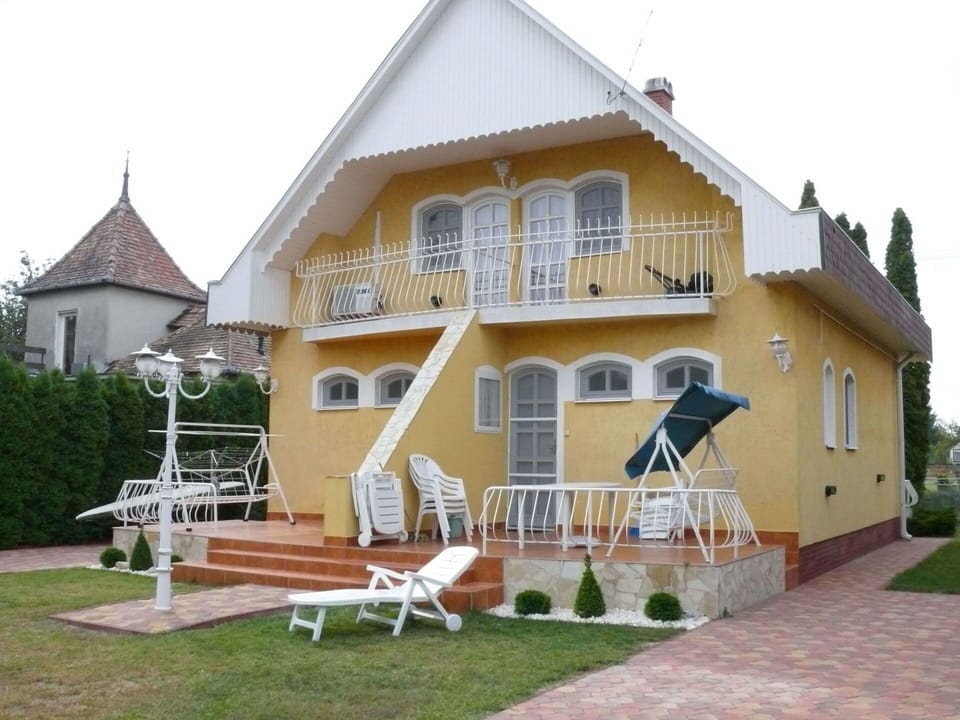 Plant, Sky, Property, Window, Building, Porch, Land Lot, Outdoor Furniture, Grass, Umbrella