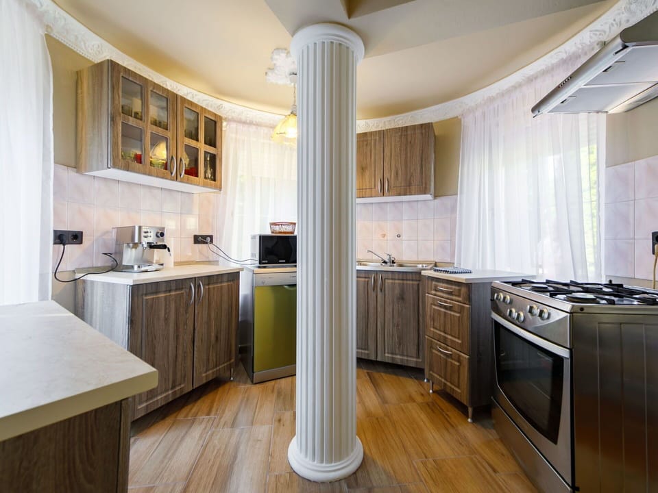 Countertop, Cabinetry, Property, Furniture, Window, Kitchen, Table, Building, Wood, Kitchen Stove