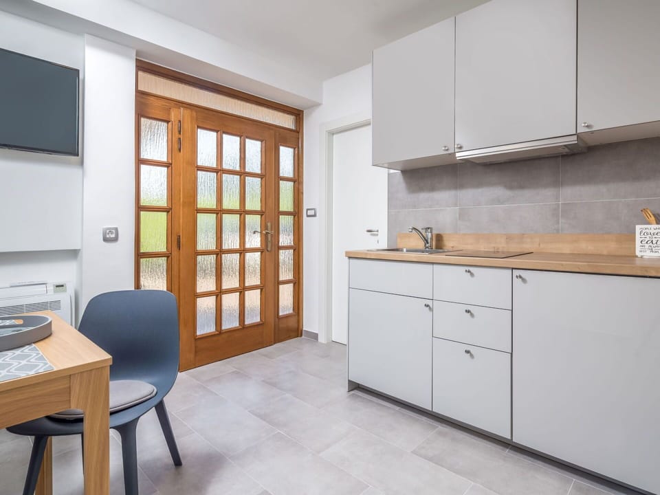 Cabinetry, Furniture, Property, Countertop, Table, Building, Interior Design, Sink, Chair, Wood