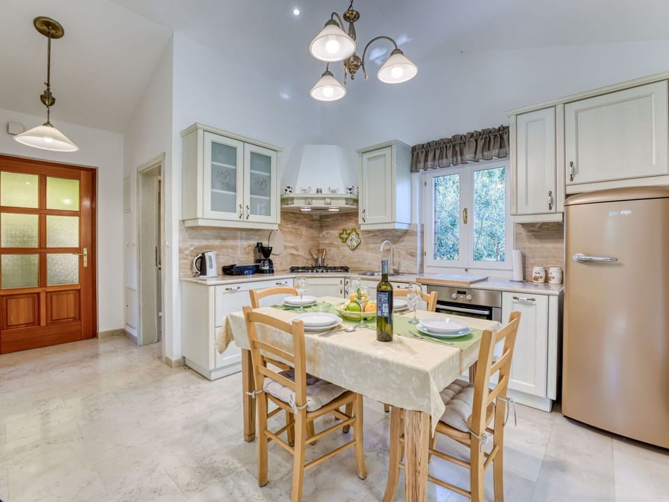 Furniture, Interior Design, Flooring, Floor, Wood, Ceiling, Kitchen, Room, Cabinetry, Countertop