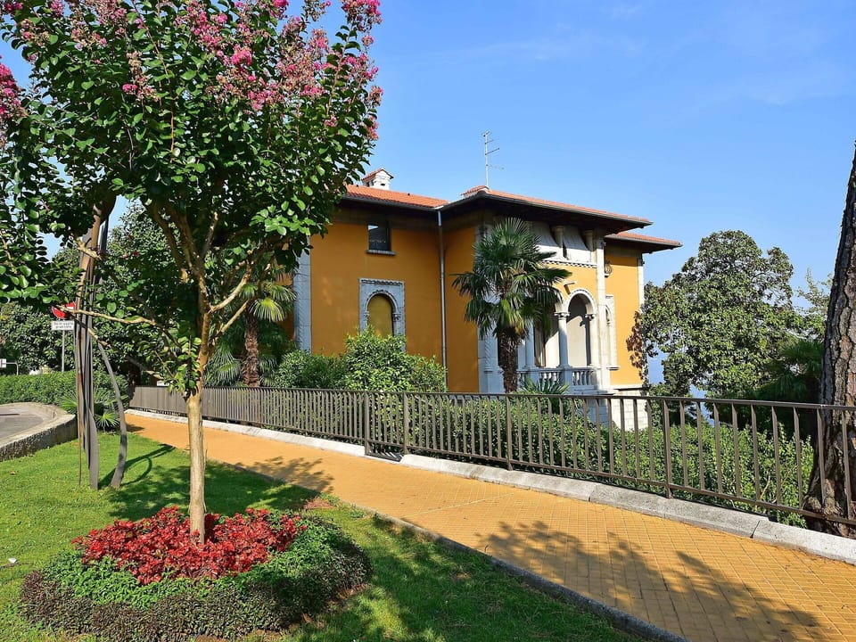 Plant, Sky, Building, Flower, Tree, Grass, Land Lot, House, Vegetation, Shade