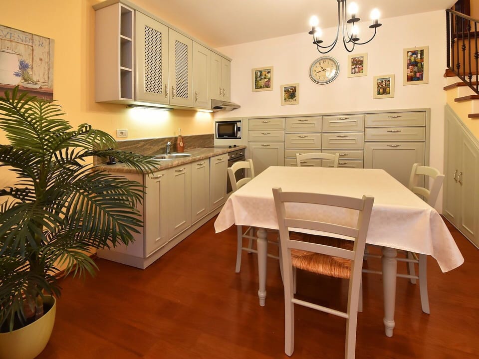 Cabinetry, Furniture, Property, Countertop, Table, Picture Frame, Plant, Chair, Drawer, Houseplant