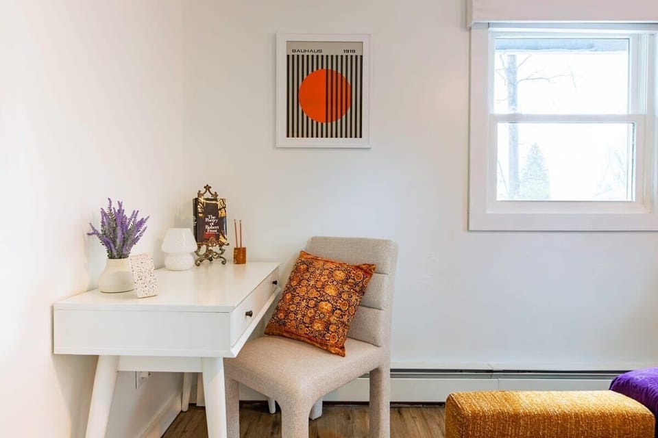 [Bedroom #2, Upstairs] A dedicated workstation awaits, accompanied by a serene lakeview just beyond the window.