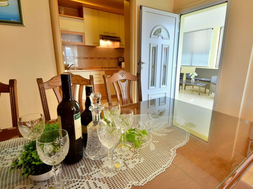 Table, Furniture, Tableware, Property, Plant, Drinkware, Building, Chair, Stemware, Wood