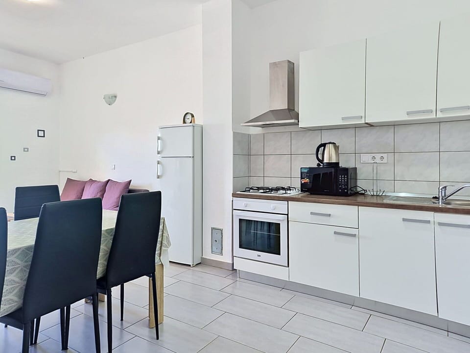 Flooring, Furniture, Interior Design, Floor, Major Appliance, Countertop, Kitchen, Kitchen Appliance, Room, Ceiling
