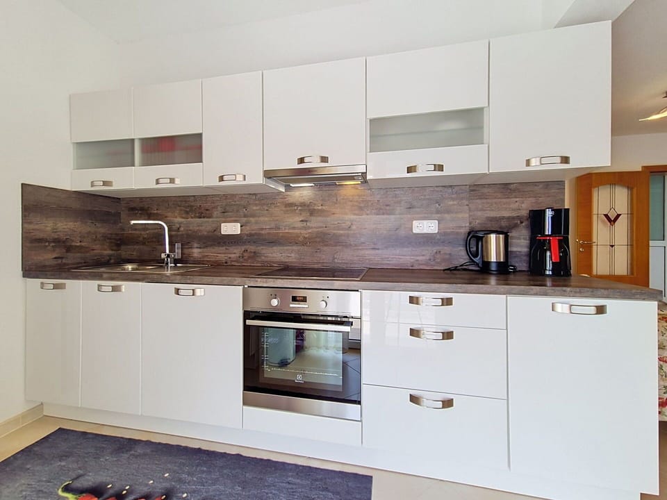 Kitchen, Cabinetry, Countertop, Kitchen Appliance, Interior Design, Major Appliance, Flooring, Wood, Furniture, Home Appliance