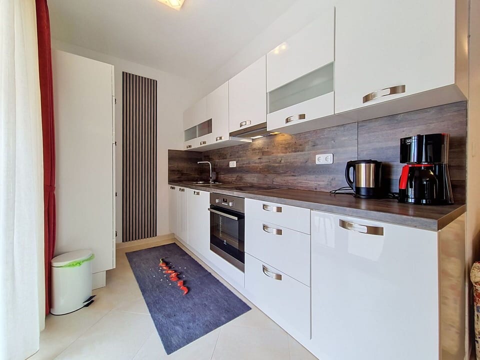 Interior Design, Countertop, Flooring, Wood, Cabinetry, Kitchen, Major Appliance, Kitchen Appliance, Floor, Room