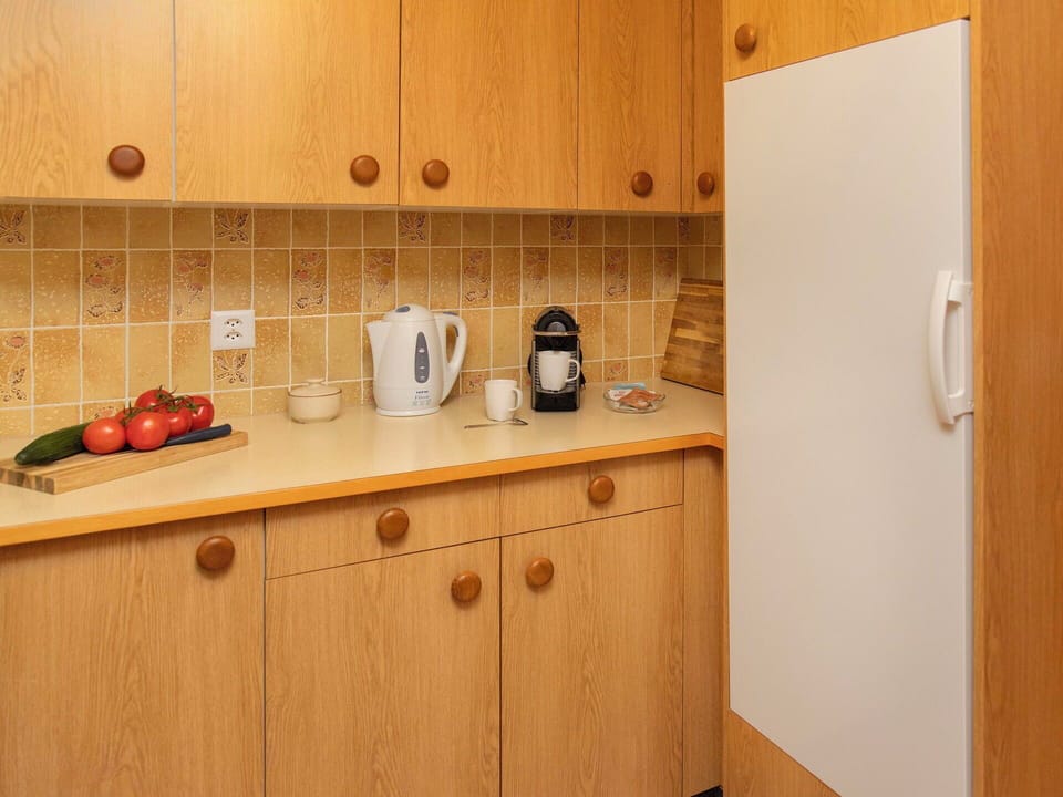 Countertop, Cabinetry, Wood, Kitchen, Flooring, Interior Design, Kitchen Appliance, Cupboard, Room, Tap