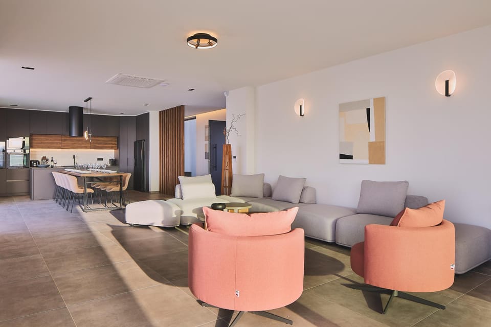 Open-plan living area adorned with plush sofas and armchairs.