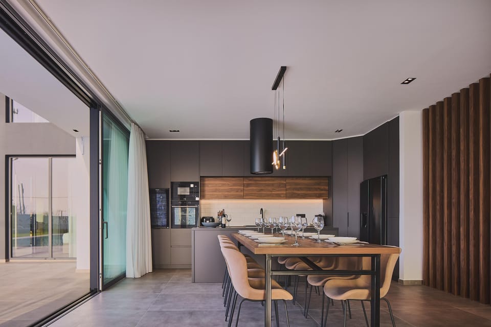 The kitchen is fully equipped and includes a modern kitchen island design.