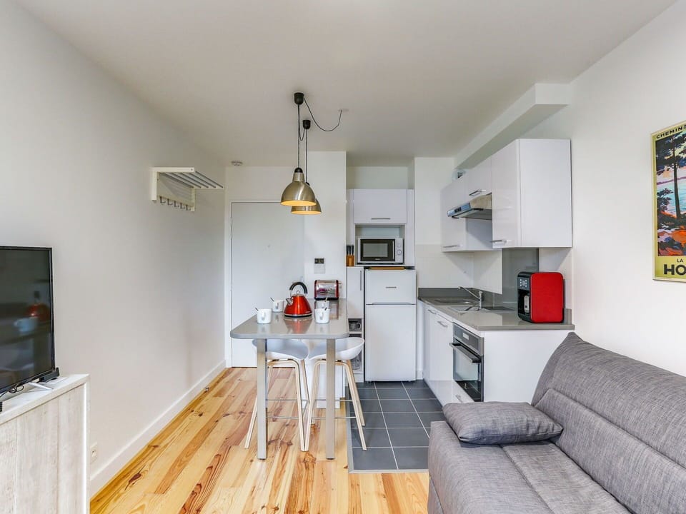 Furniture, Couch, Picture Frame, Table, Cabinetry, Wood, Flooring, Floor, Living Room
