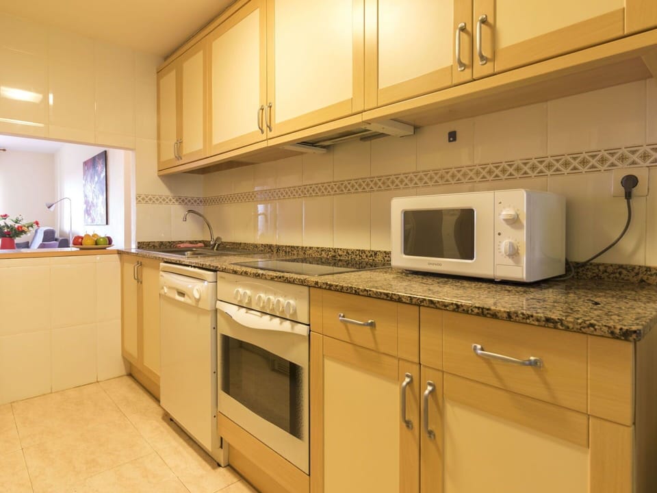Countertop, Cabinetry, Property, Furniture, Kitchen Appliance, Kitchen, Home Appliance, Kitchen Stove, Wood, Microwave Oven