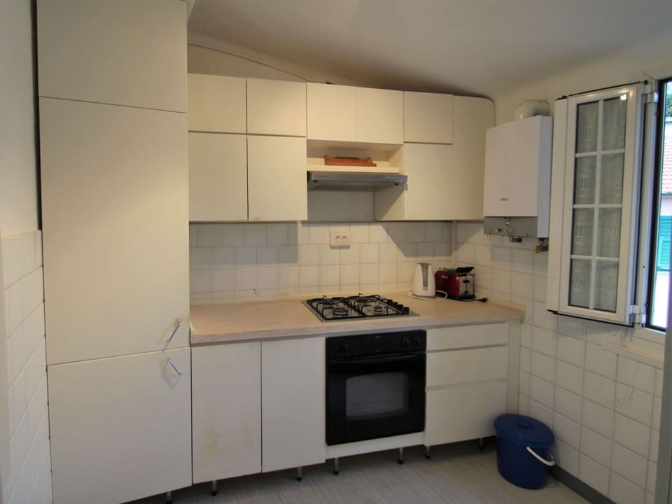 Cabinetry, Countertop, Window, Kitchen Appliance, Kitchen Stove, Home Appliance, Kitchen, Flooring, Floor, Major Appliance