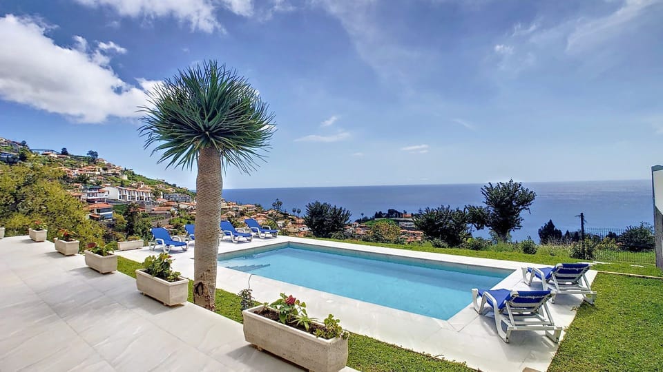 A charming Funchal villa with an inviting pool, sweeping ocean vistas #poolview #oceanview #panorama