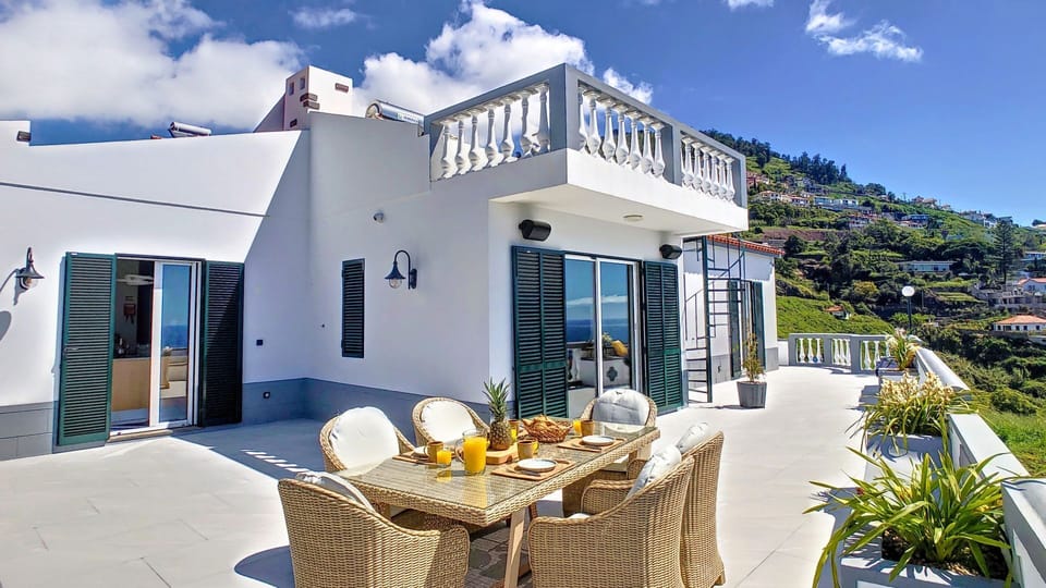 The façade of this Funchal villa seamlessly marries traditional architectural elegance with contemporary design elements, inviting you to experience the best of both worlds.