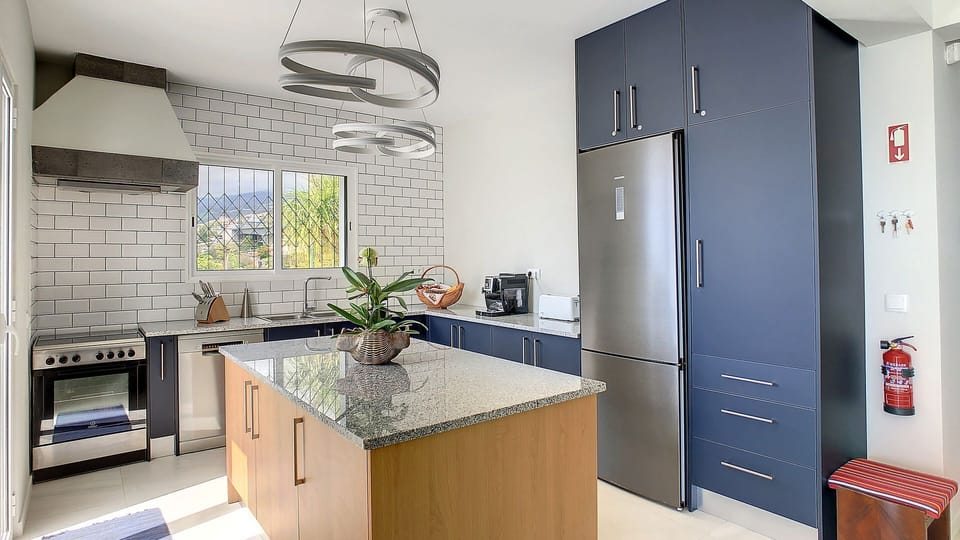 This kitchen combines modern functionality with inviting aesthetics, providing a delightful space to create delicious meals. #kitchen #coffeemachine