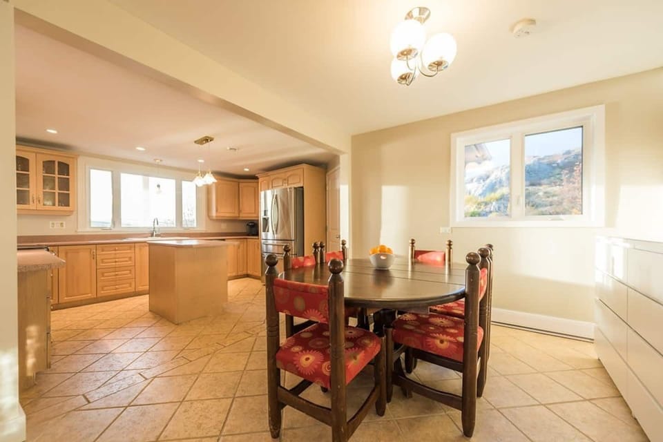 Beautiful kitchen and secondary dining area perfectly complement the living room area.