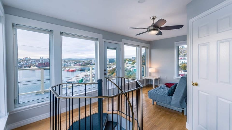 The upper loft, featuring a futon that converts into a bed,  has its own deck with eye-popping view,  and adjoining bathroom