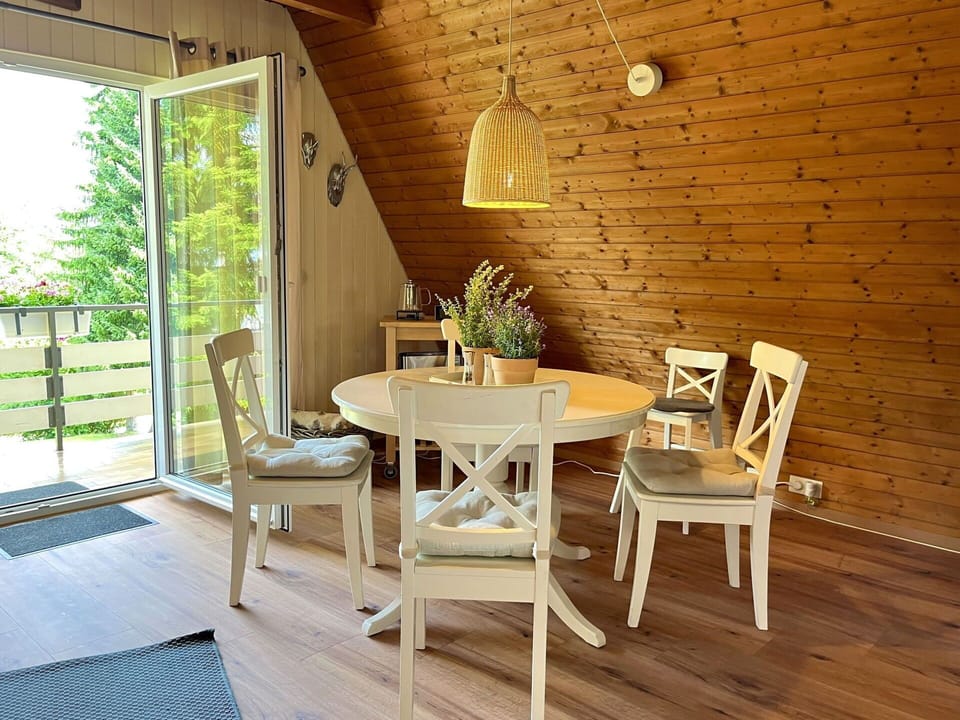 Furniture, Interior Design, Flooring, Chair, Wood, Table, Wood Flooring, Kitchen & Dining Room Table, Floor, Dining Room