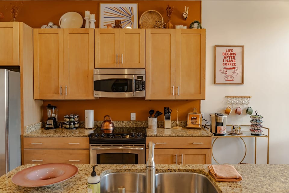 Kitchen: Beautiful cabinetry and our coffee station for your morning cup of joe.