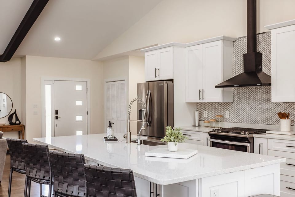 Fully equipped kitchen with seating at the bar