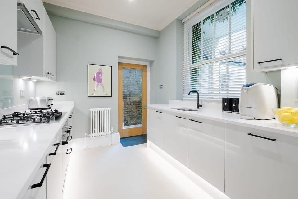 Full Kitchen | Impeccably Stocked Kitchen, Featuring Essential Appliances and Luxuries including a Filtered Water Dispenser and Nespresso Machine with Vertuo Pods Provided. Martini, Champagne, and Wine Glasses Included.