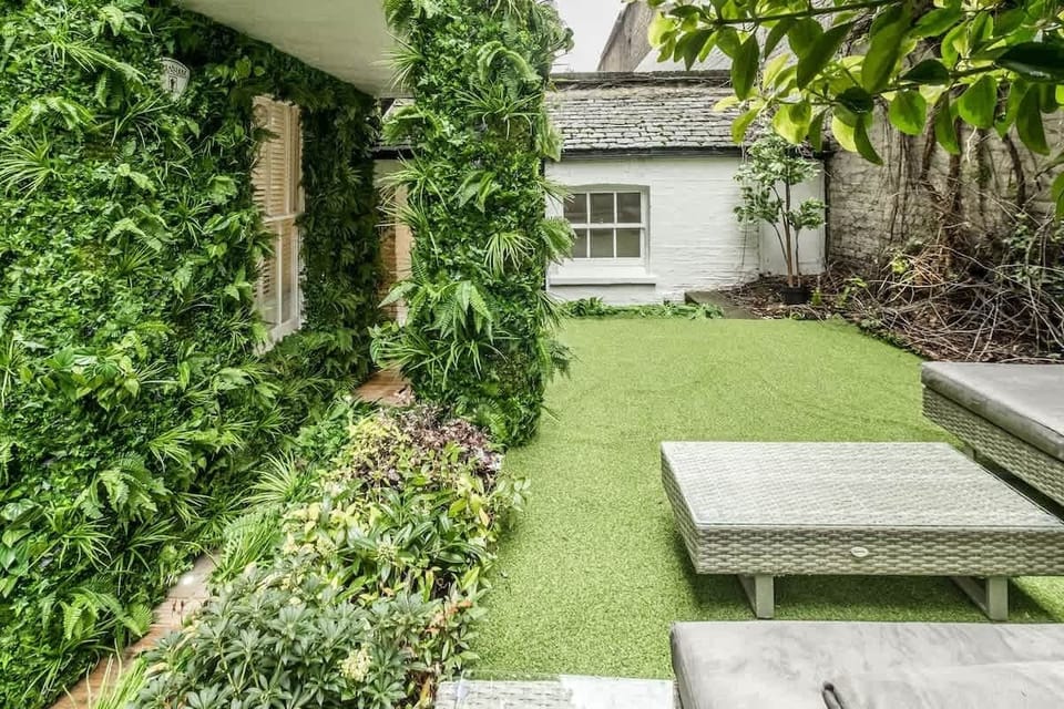 Garden | Exquisitely Designed Private Garden Oasis with Inviting Seating Area