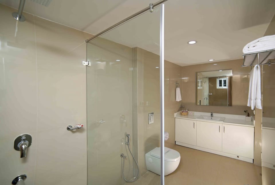 Shower, rainfall showerhead, designer toiletries, hair dryer