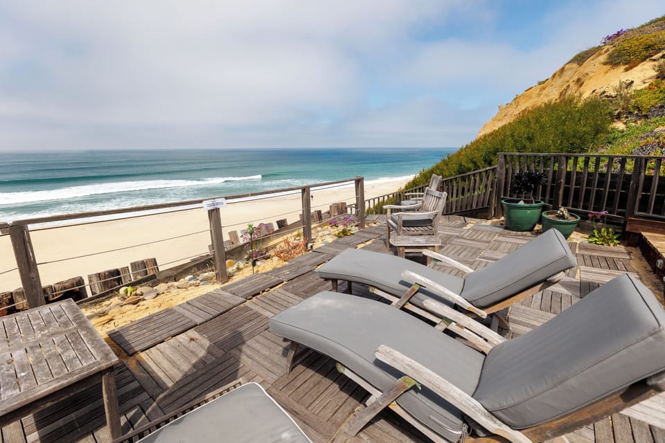 Enjoy beach life from the community sun deck with beach access