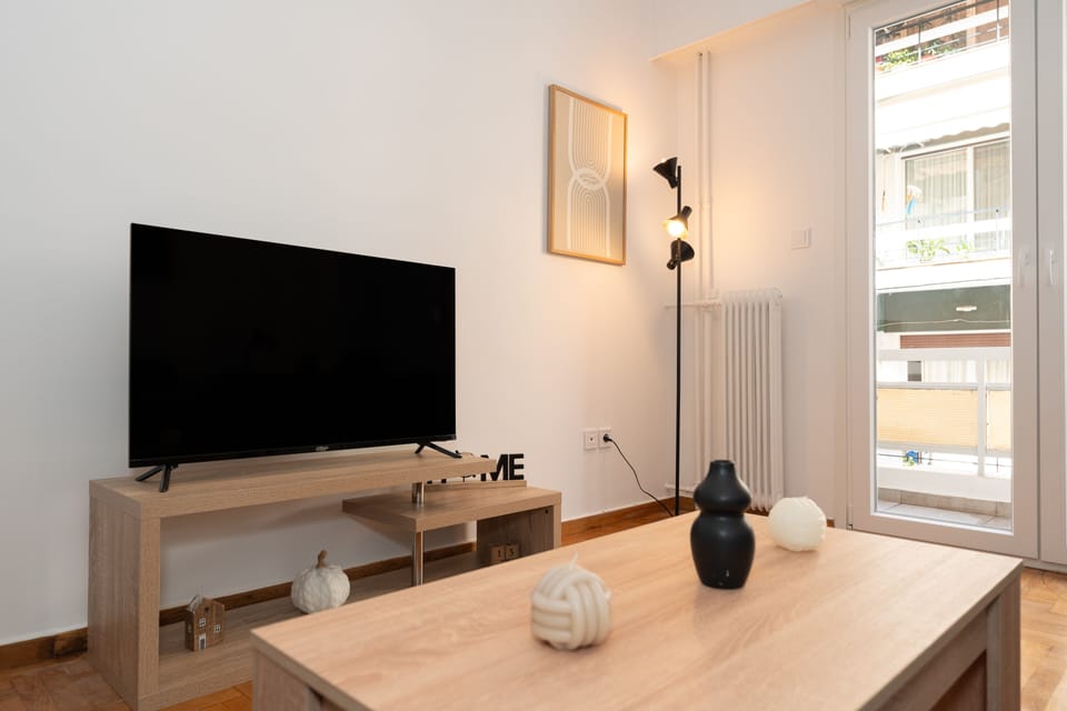 Superior Apartment | Living area | 43-inch flat-screen TV with cable channels