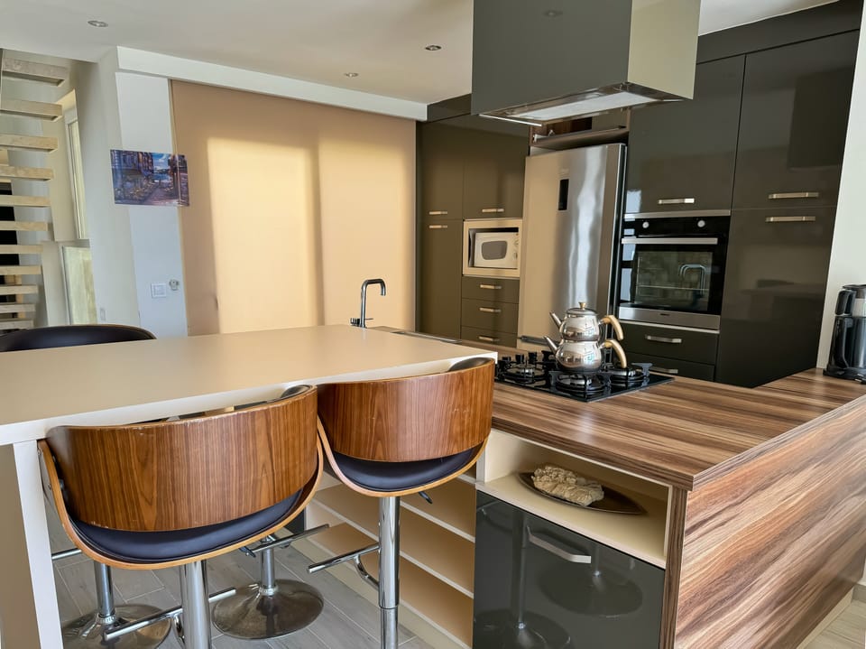Exclusive Villa | Private kitchen | Full-size fridge, microwave, oven, stovetop