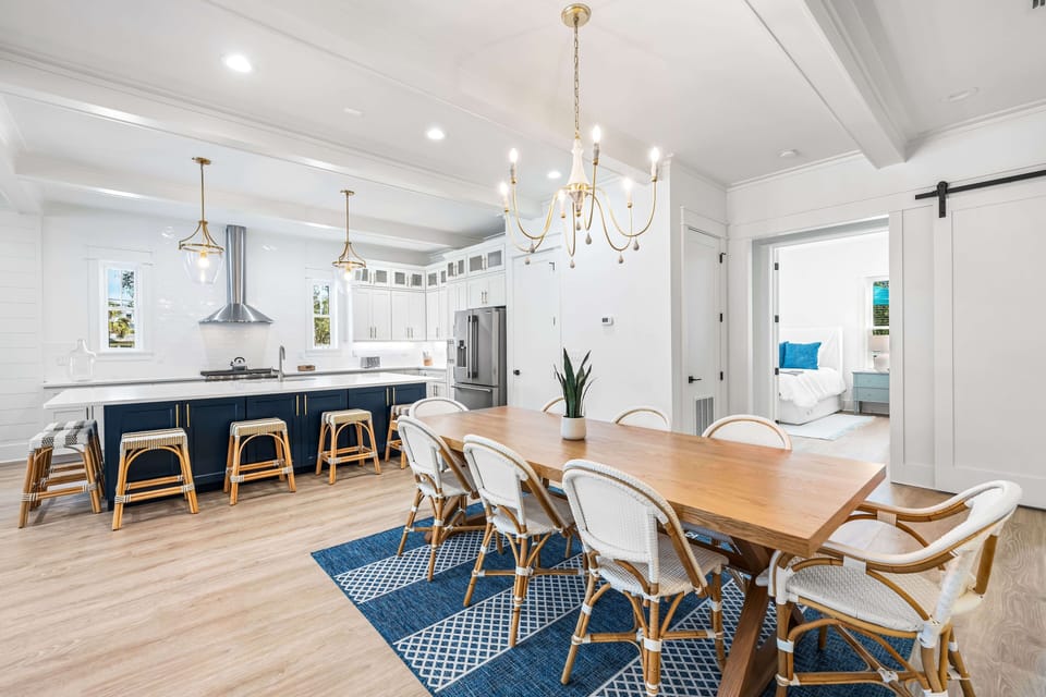 Dining table seats 8 with nearby breakfast bar seating