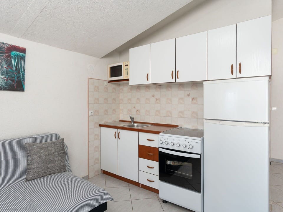 Furniture, Wood, Interior Design, Flooring, Floor, Room, Cabinetry, Home, Apartment, Major Appliance