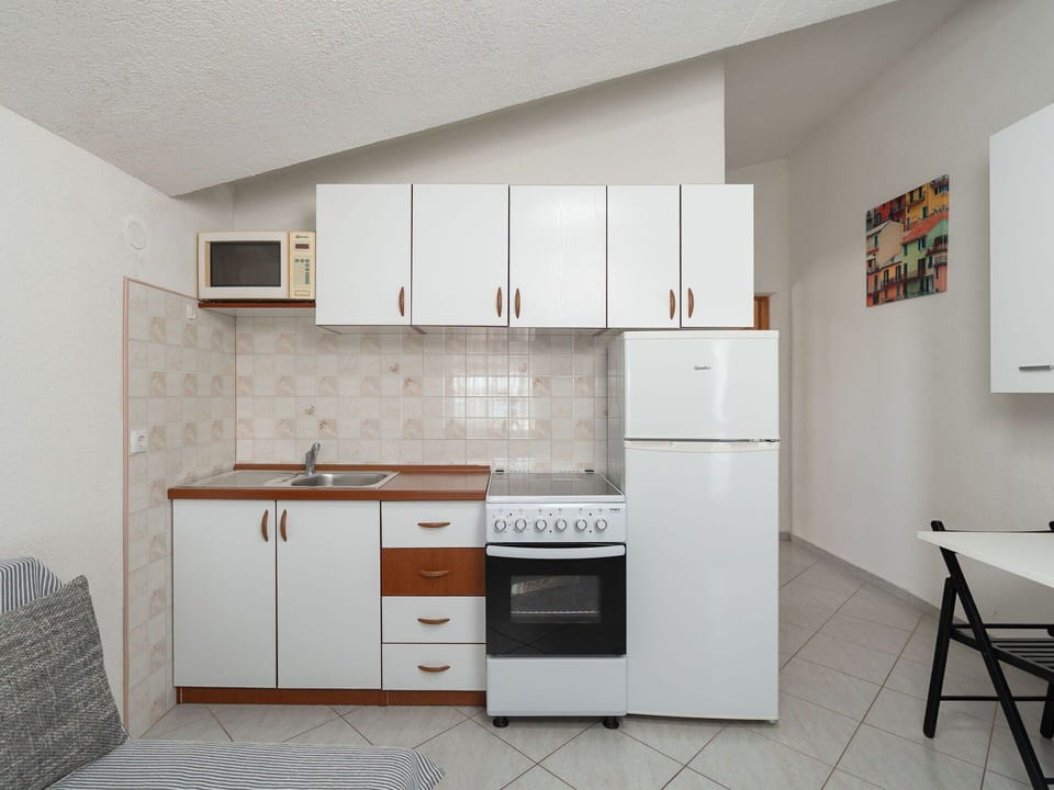 Furniture, Interior Design, Flooring, Wood, Floor, Major Appliance, Cabinetry, Kitchen, Room, Ceiling