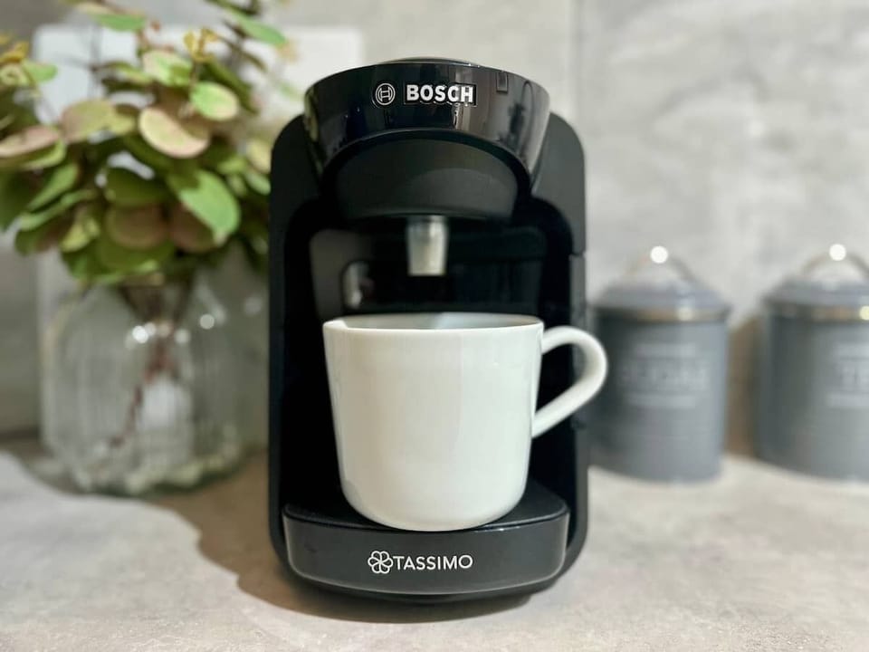 Bosch coffee machine to prepare your morning coffee before starting the day and epxlore the charm of Portsmouth at Blue Puffin Stays Short Lets & Serviced Accommodation