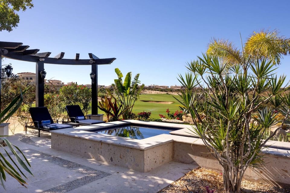 Jacuzzi beside the pergola lounge