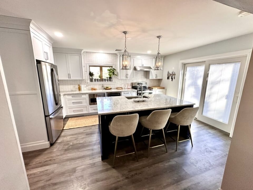 Upstairs kitchen that opens out to the deck and pool.  Chefs kitchen