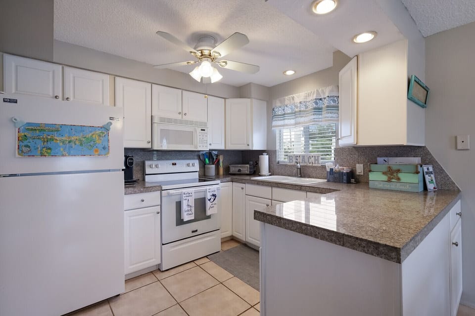 Kitchen - Bright lighting and tons of natural light throughout the unit