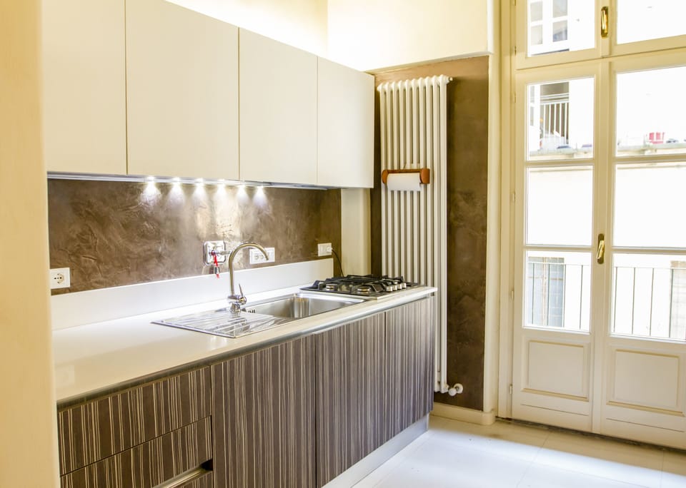 Superior Apartment, Courtyard Area | Private kitchen | Full-size fridge, microwave, oven, stovetop