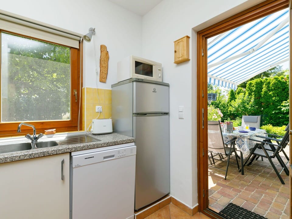 Cabinetry, Kitchen Sink, Countertop, Sink, Window, Building, Tap, Kitchen Stove, Wood, Plumbing Fixture