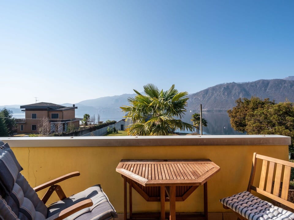 Sky, Furniture, Building, Property, Mountain, Azure, Tree, Outdoor Furniture, Shade, House