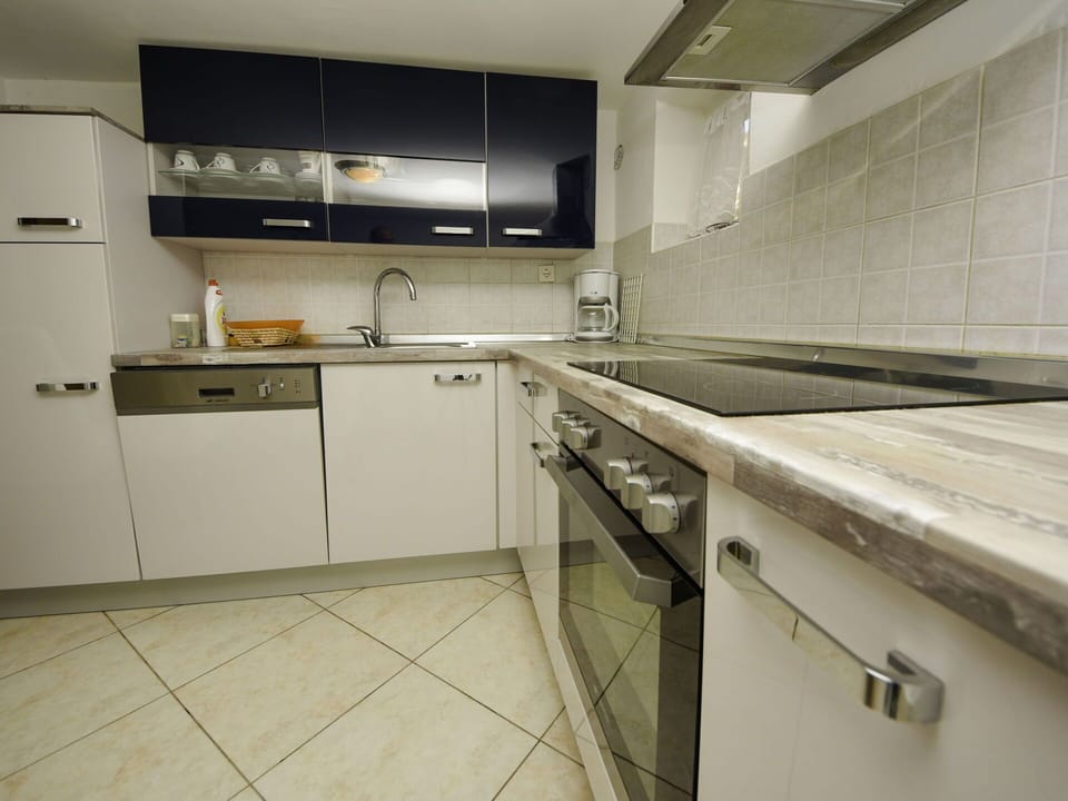 Countertop, Cabinetry, Kitchen Sink, Furniture, Sink, Tap, Kitchen Stove, Kitchen Appliance, Kitchen, Home Appliance