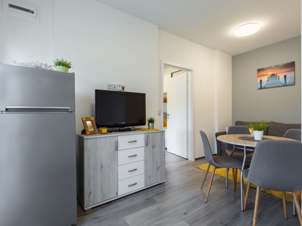Building, Furniture, Cabinetry, Table, Chair, Television, Drawer, Houseplant, Lighting, Chest Of Drawers