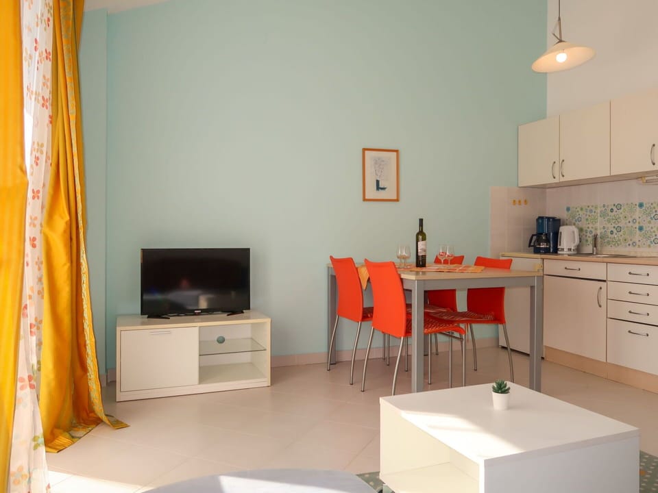 Furniture, Property, Table, Cabinetry, Orange, Comfort, Drawer, Interior Design, Lighting, Wood