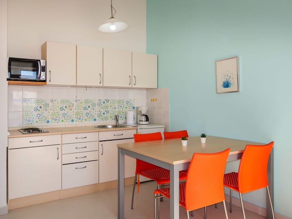 Table, Furniture, Cabinetry, Property, Chair, Building, Wood, Interior Design, Lighting, Kitchen