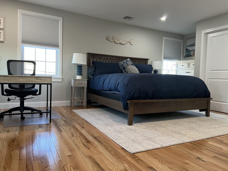 Master bedroom with king bed and dedicated work space