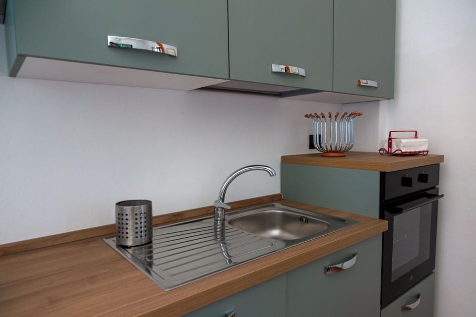 Kitchen, Countertop, Cabinetry, Wood, Kitchen Sink, Interior Design, Flooring, Kitchen Appliance, Plumbing Fixture, Furniture